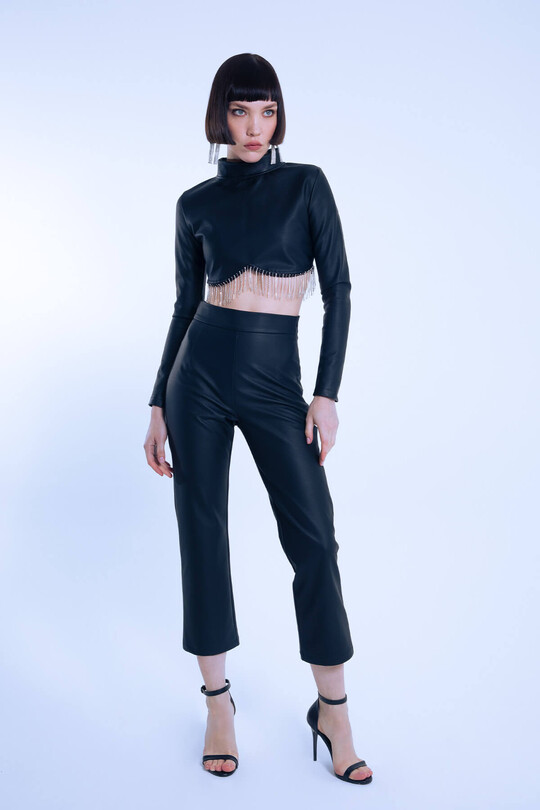 Black long-sleeve leather blouse with embellished hem 