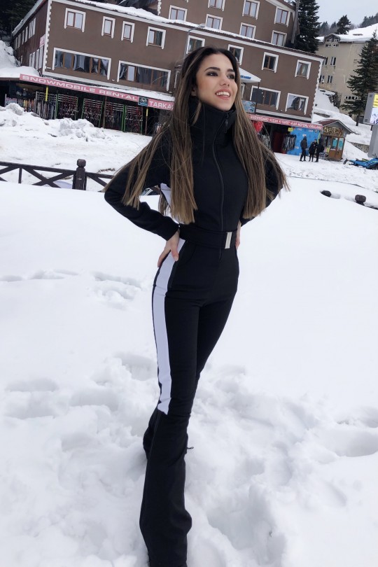 Schwarzer Softshell-Skioverall mit ausgestelltem Bein und seitlichen Streifen - 2
