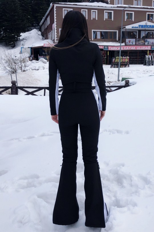 Schwarzer Softshell-Skioverall mit ausgestelltem Bein und seitlichen Streifen - 8