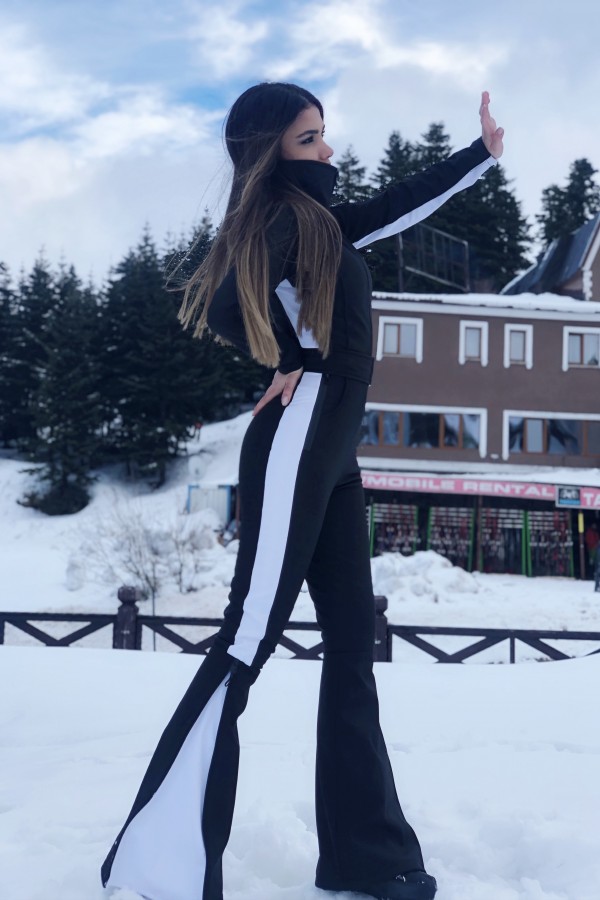 Schwarzer Softshell-Skioverall mit ausgestelltem Bein und seitlichen Streifen - 1